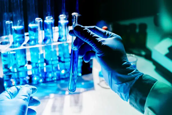 Vials of medicine on a production line, representing healthcare operations.